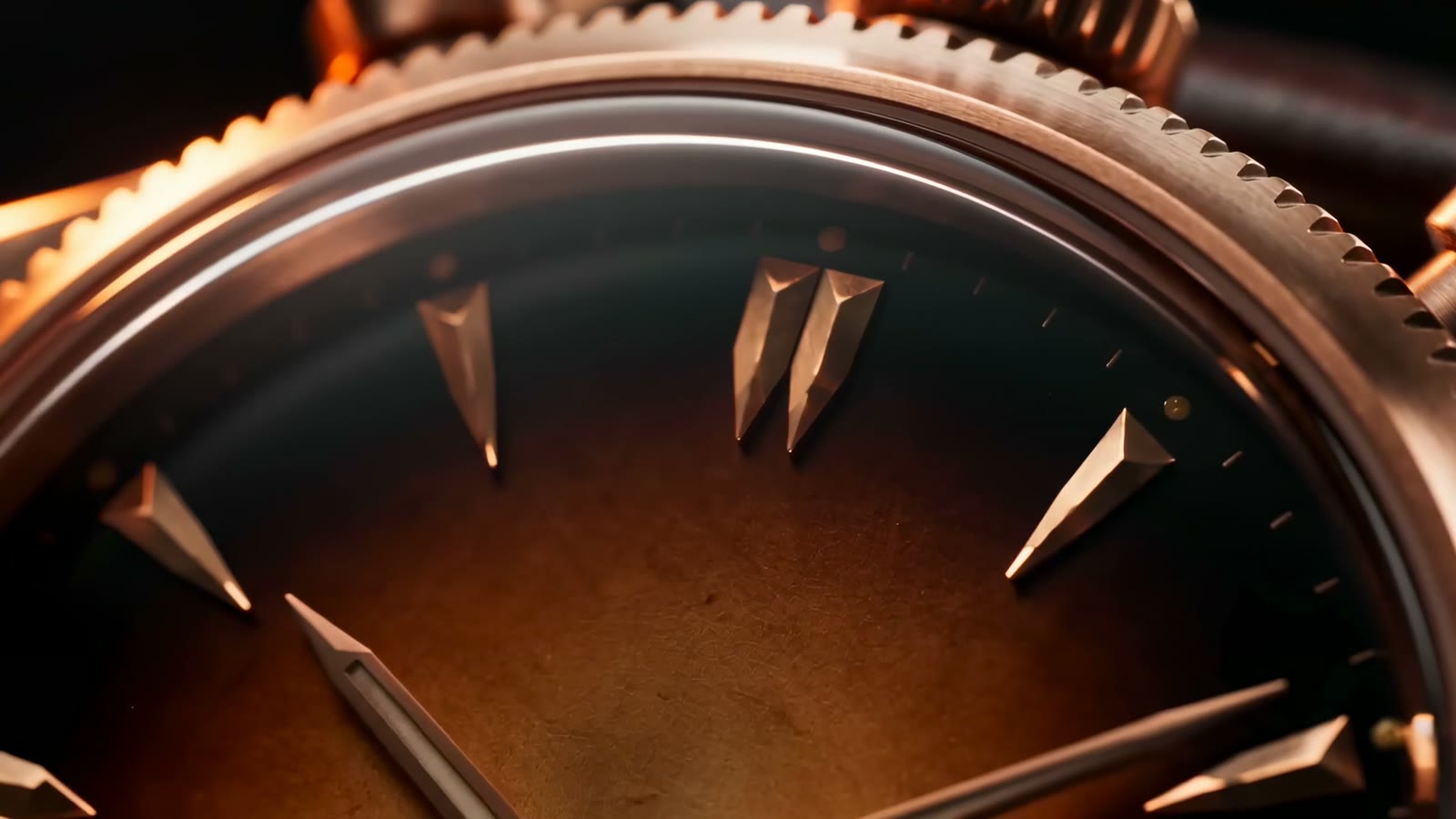 Macro — faceted indices on the smoked amber dial